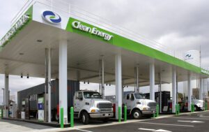 Clean Energy natural gas fueling station with two heavy-duty trucks fueling