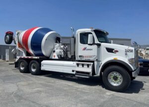 Cement truck with red and blue stripes