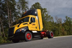 Yellow Freightliner heavy duty CNG truck