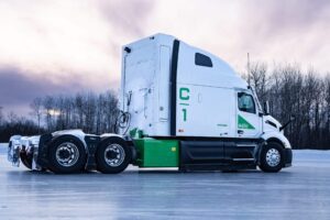 White and green Class 8 truck powered by natural gas generator.